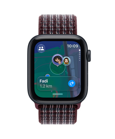 Apple Watch SE 3, aluminum case, midnight color, screen shows Find My app (memojis on a map background), right side exterior, Digital Crown dial, Sport Loop band, burgundy plaid color