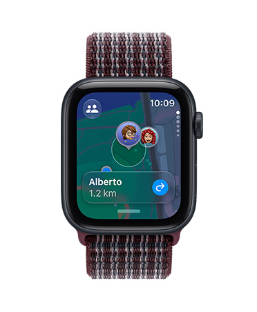 Apple Watch SE 3, aluminium case, midnight colour, screen shows Find My app (memojis on a map background), right side exterior, Digital Crown dial, Sport Loop strap, burgundy plaid colour
